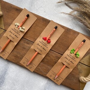 There are flowers and a pencil with seeds on the card.