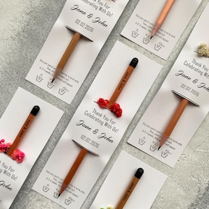 There are flowers and a pencil with seeds on the card.