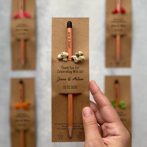 There are flowers and a pencil with seeds on the card.