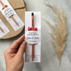 There are flowers and a pencil with seeds on the card.