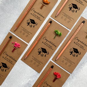There are flowers and a pencil with seeds on the card.