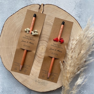 There are flowers and a pencil with seeds on the card.