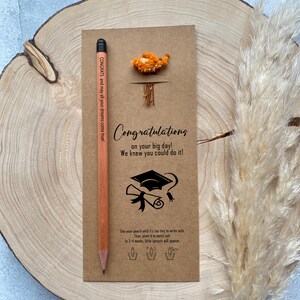 There are flowers and a pencil with seeds on the card.