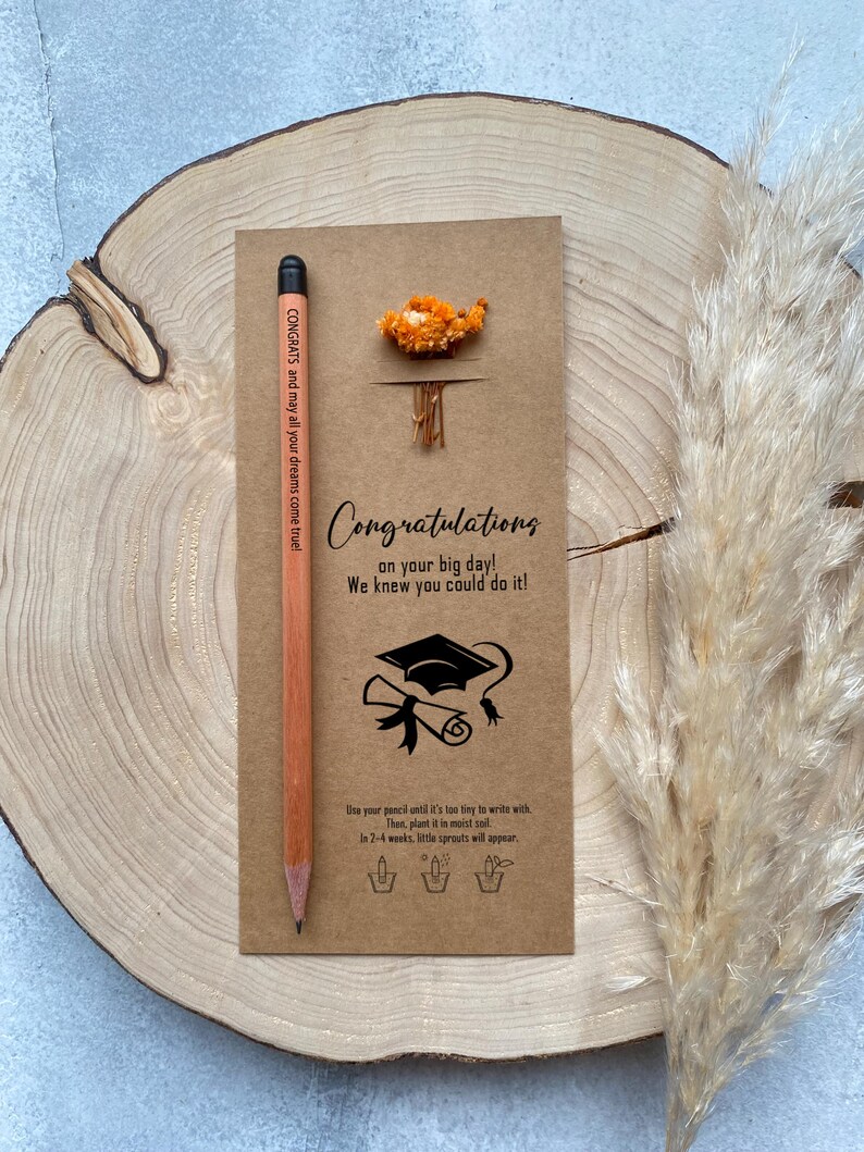 There are flowers and a pencil with seeds on the card.