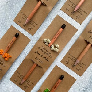 There are flowers and a pencil with seeds on the card.