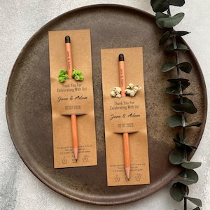 There are flowers and a pencil with seeds on the card.