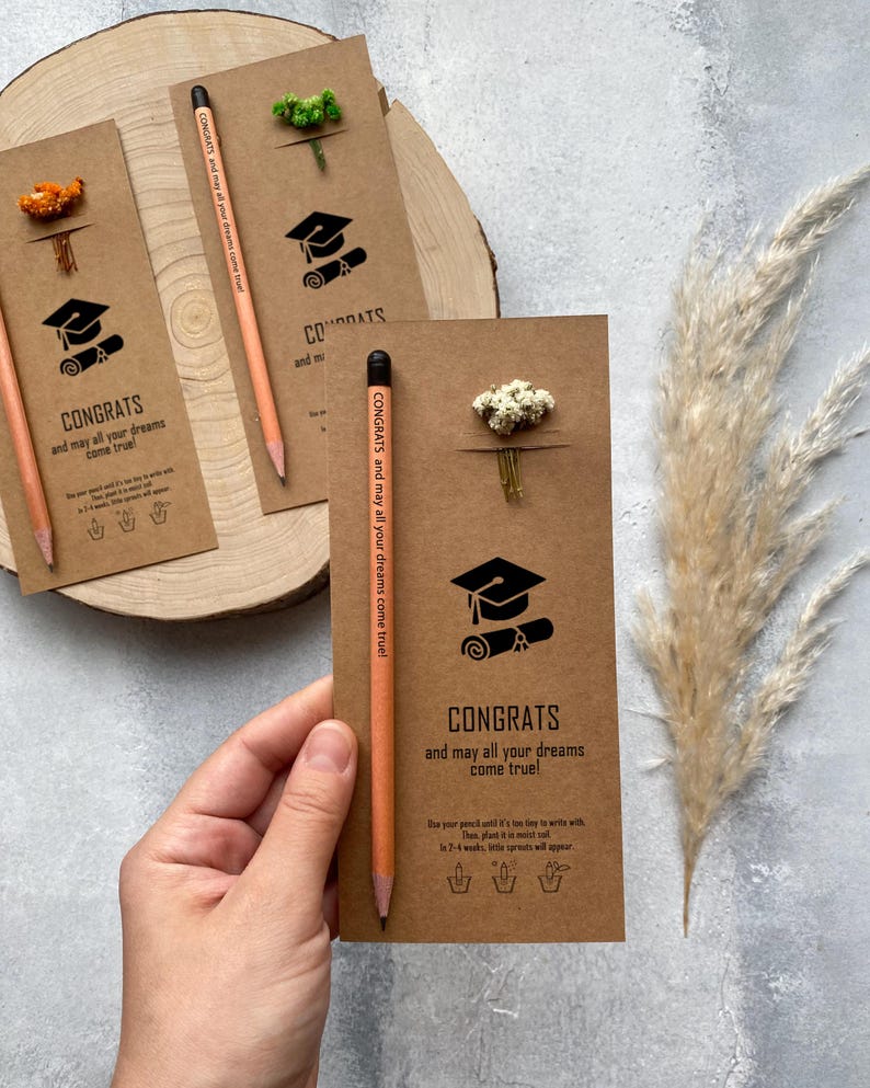 There are flowers and a pencil with seeds on the card.