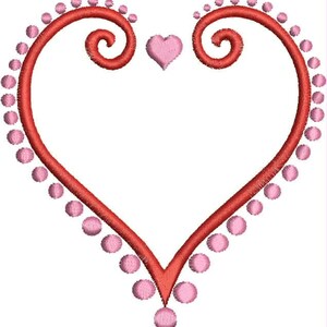 May include: A red heart-shaped frame with pink dots around the edge. The frame has a swirl design at the top and bottom.