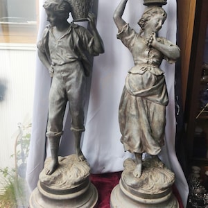 May include: A set of three ceramic mugs with a speckled, matte finish. The mugs are in shades of cream, light brown, and dark brown. Each mug has a simple, minimalist design, perfect for coffee or tea.