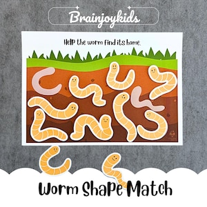 Op de afbeelding: Een educatief spel voor kinderen met een witte kaart. De kaart heeft de tekst "Brainjoykids" en "Help the worm find its home". Het heeft een ontwerp van aarde en gras met lachende wormvormen. De woorden "Worm Shape Match" staan onderaan.