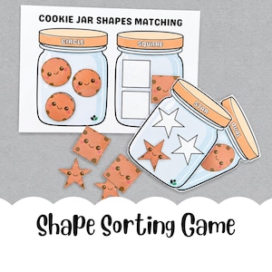 May include: A shape sorting game with cookie jar illustrations. The game includes jars labelled "Circle", "Square", "Star", and "Oval", with matching cookie shapes. The text "Cookie Jar Shapes Matching" is at the top.
