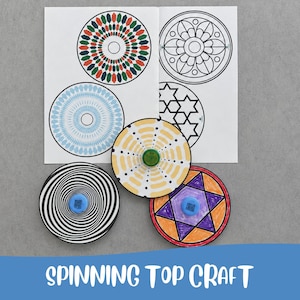 May include: A set of paper spinning tops featuring various geometric patterns in black, white, yellow, orange, purple, and blue. The tops include circular designs with star motifs and optical illusions, accompanied by a printed sheet of paper templates.