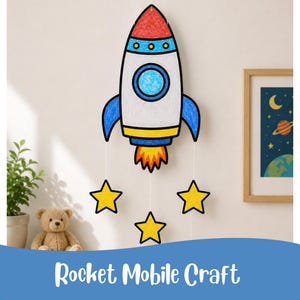 May include: A colorful, handmade rocket mobile craft with a red and white body, blue fins, and yellow accents. Three yellow stars dangle below. The text "Rocket Mobile Craft" is at the bottom of the image.