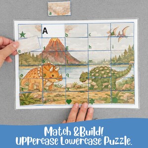 May include: A dinosaur-themed puzzle with uppercase and lowercase letters. The puzzle features illustrations of dinosaurs, a volcano, and a lake. The text "Match & Build! Uppercase Lowercase Puzzle" is at the bottom.