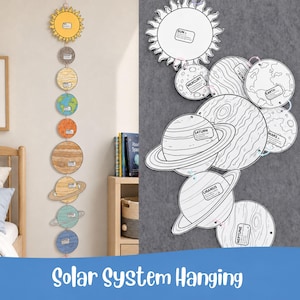 May include: A vertical solar system hanging mobile featuring a yellow sun and eight planets in various colours, each with a small label. A second version shows the same celestial bodies as black and white line art illustrations for colouring.