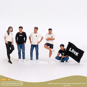 May include: Miniature figurines of a team of people in casual attire. The figures are wearing t-shirts, jeans, and shorts. One figure holds a black flag with "LBWK" in white. The figures are standing and kneeling. The scale is 1:64.