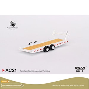May include: A white and tan car hauler trailer model with black wheels. The model has a wooden deck and red accent lights. The text "AC21 Prototype Sample, Approval Pending" is visible. The model is 1:64 scale.