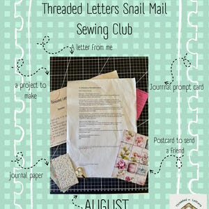 Puede incluir: Un kit Threaded Letters Snail Mail Sewing Club que incluye una carta, un proyecto para realizar, una tarjeta de sugerencias para diario, papel para diario, una postal y accesorios. Los artículos están sobre una base de corte negra.