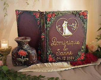 Wedding couple in heart guest book. Mr & Mrs. Personalized Bride and Groom wedding guest book and set. Red roses, brown, gold decors.