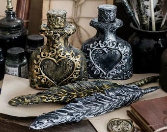 Gothic Stationery Set: Ornate Quill feather Pen, Hand-Sculpted Heart Holder, and Matching Inkwell Bottle.