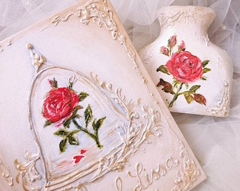 May include: A white wooden box with a gold trim and a painted rose in a birdcage. The box is decorated with the text "James & Lisa" and the date "19.9.2019". The text "IndrasIdeas" is also visible on the box. A white vase with a painted rose is also visible in the image.
