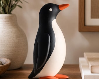 Scultura in legno di pinguino moderna, ideale per decorare mensole e come regalo per gli amanti dei pinguini.