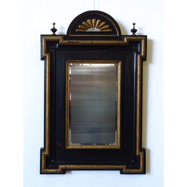 Antique  ebonized  and  guilded  Italian  mirror