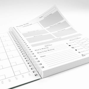 May include: A spiral-bound planner with white pages featuring black text and grid lines. The layout includes sections for Monthly To Do, Important Jobs, What To Plant, What To Harvest, What To Prune, Maintenance Jobs, Reflection, and Weather Conditions.