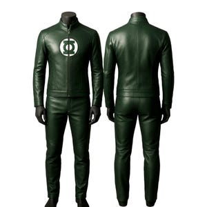 May include: Green leather jacket and pants set. The jacket features a zip-up front and a circular emblem on the chest. The pants are a matching green color. The outfit is displayed on a mannequin.