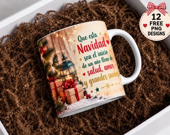 Puede incluir: Una taza de cerámica blanca con un diseño navideño que incluye una linterna, regalos envueltos y el texto: Que esta Navidad sea el inicio de un año lleno de salud, amor y grandes sueños. La taza está colocada dentro de una caja de regalo.