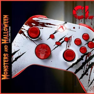 Peut inclure: Manette Xbox blanche et rouge sur le thème d'Halloween. La manette présente des boutons et des accents rouges, avec des griffures et des éclaboussures de sang. Le texte "CLAWS" est en haut et "Monsters and Halloween Collection" sur le côté.
