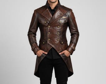 May include: A brown leather coat with a double-breasted design and brass buttons. The coat has a tailored fit and a unique, asymmetrical hemline. The model is wearing a black shirt and black pants.