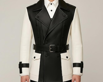 May include: A two-tone black and white leather jacket with a double-breasted design. The jacket features a belt, two front pockets, and black accents on the sleeves. The jacket is worn over a white collared shirt.