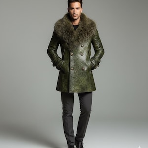 May include: A green leather coat with a fur collar and double-breasted buttons. The coat is worn with gray pants and black shoes. The model is standing in front of a gray background. The coat's texture appears to be embossed.