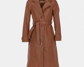 May include: A full-length, brown leather trench coat with a belted waist and button-down front. The coat features a classic collar, long sleeves, and a tailored fit. The coat is a stylish outerwear garment.