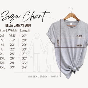The image is a size chart for a gray t-shirt, providing measurements for different sizes such as XS, S, M, L, XL, 2XL, 3XL, and 4XL. The chart also includes a diagram of a person's torso and arms, along with the text "Size Chart" and "UNISEX JERSEY - SHIRT".