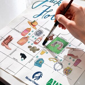 May include: A watercolor map of Jack Hole featuring numbered illustrations of local items like a cowboy boot, hat, coin, bottle, and bear head. The map includes street names, the Mutual of Omaha logo, and the Advantage Insurance Network logo.
