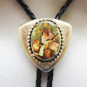 Vintage Goldtone Bolo Tie: Man Playing Guitar, 36&quot; Leatherette Cord