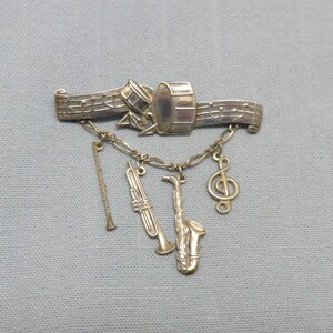 1970s  Sterling Silver Band and Musical Instruments Pin