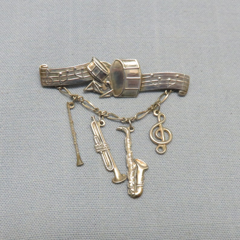 1970s Sterling Silver Band and Musical Instruments Pin