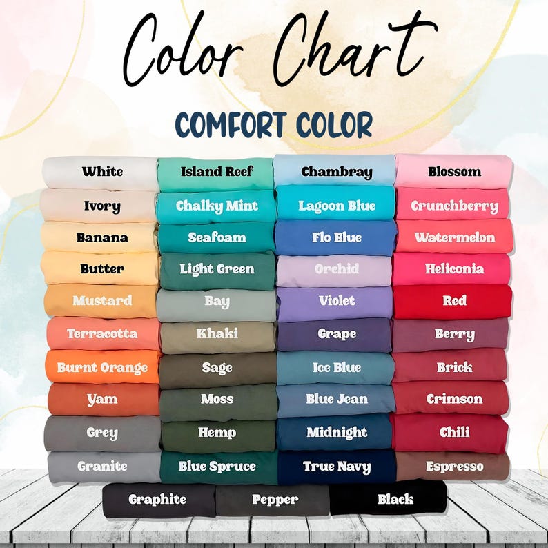 May include: A color chart displaying a variety of Comfort Color fabric swatches. The chart includes colors such as white, ivory, banana, mustard, terracotta, yam, grey, granite, island reef, chalky mint, chambray, blossom, lagoon blue, crunchberry, seafoam, flo blue, watermelon, light green, orchid, heliconia, bay, violet, red, khaki, grape, berry, sage, ice blue, brick, moss, blue jean, crimson, hemp, midnight, chili, blue spruce, true navy, espresso, graphite, pepper, and black.