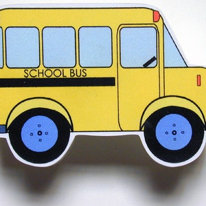 May include: A yellow toy school bus with black wheels and blue tires. The bus has a black stripe with the words "SCHOOL BUS" printed on it.