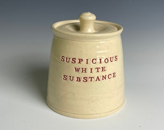 Suspicious white substance jar.