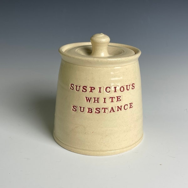 Suspicious white substance jar.