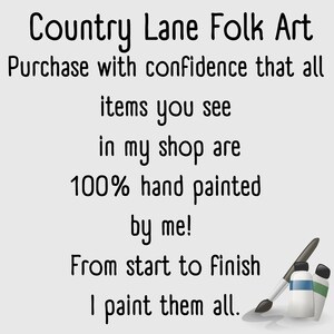 May include: The image displays the text "Country Lane Folk Art", promising that all shop items are hand-painted. A paintbrush and paint tubes in blue and green are also shown.