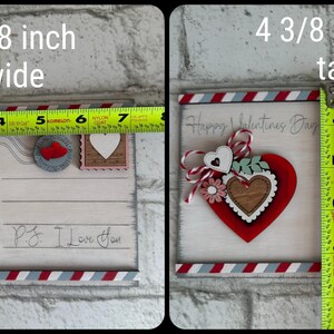 May include: A Valentine's Day wooden postcard, 18.1 cm wide and 11.1 cm tall. It features a red heart with a smaller heart in the center, decorative elements, and the text "Happy Valentine's Day" and "P.S. I love you."