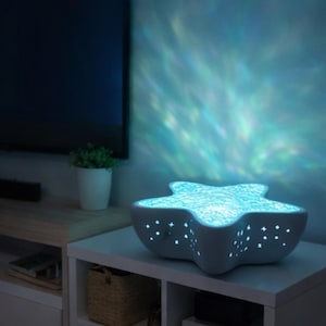 Proyector de luz nocturna con forma de estrella de mar y olas del océano, lámpara LED de 7 colores