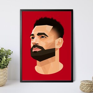May include: A framed art print featuring a geometric portrait of a man with a dark beard and hair, set against a vibrant red background. The artwork is displayed in a black frame, adding a modern touch to the decor.