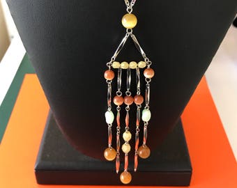 Fritter with this Rachel silver tone metal and mixed multicolored bead including cat eyes chain tassel necklace