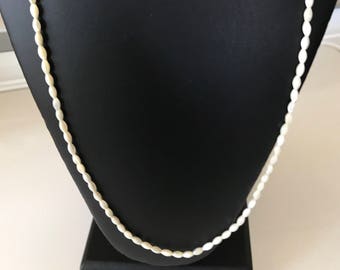 Soft White Carved Mother of Pearl 6X3mm Bead Necklace